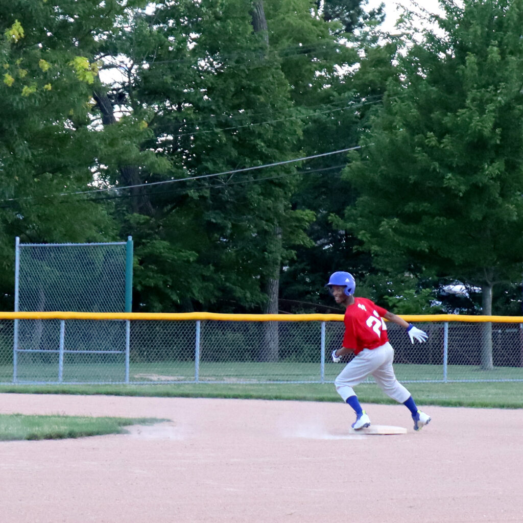 SSSRA Stingrays Softball athlete runs to second base.