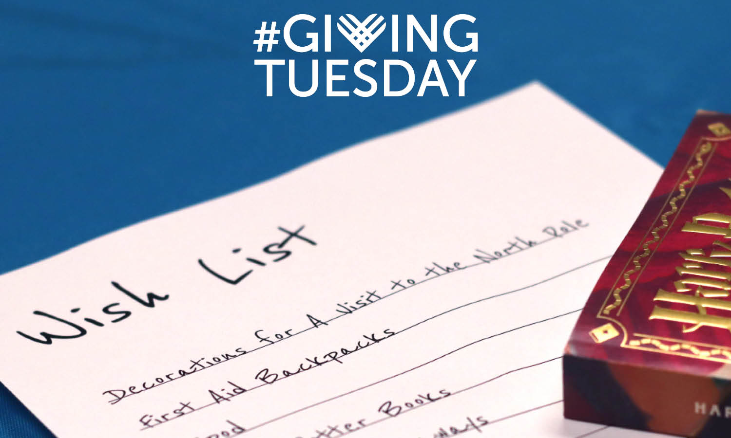 Close up photo of wish list and Harry Potter Book, GivingTuesday logo