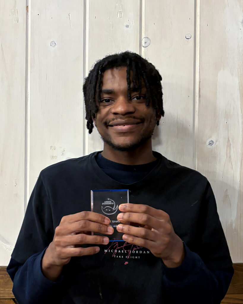 Stingrays athlete holding award