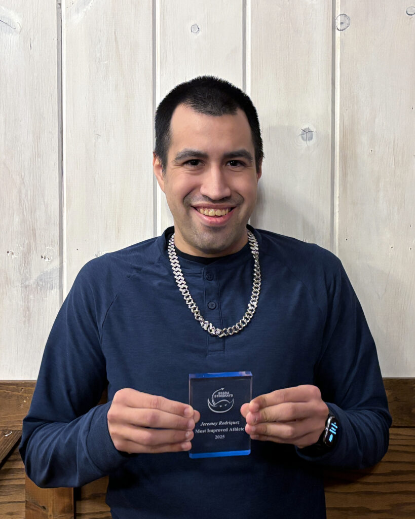 Stingrays athlete holding award