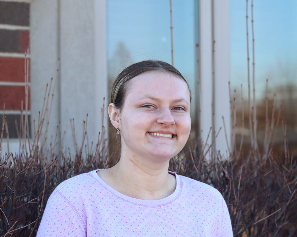 Cheyenne smiling for a picture outside of the SSSRA office.