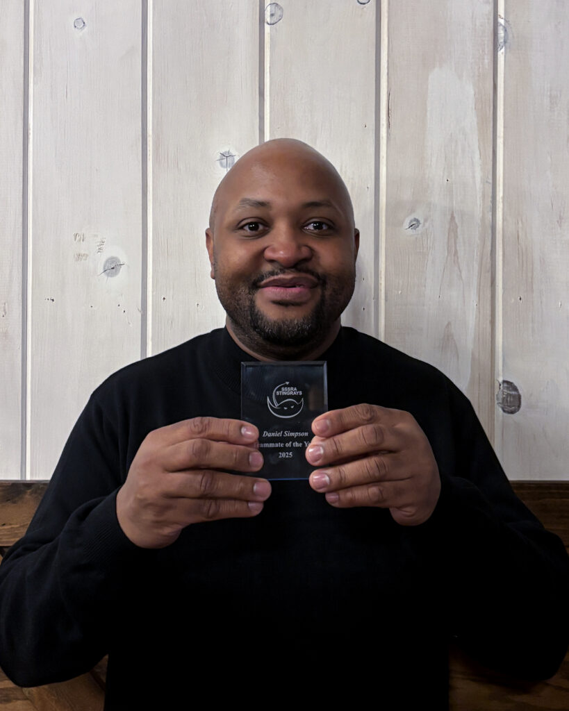 Stingrays athlete holding award