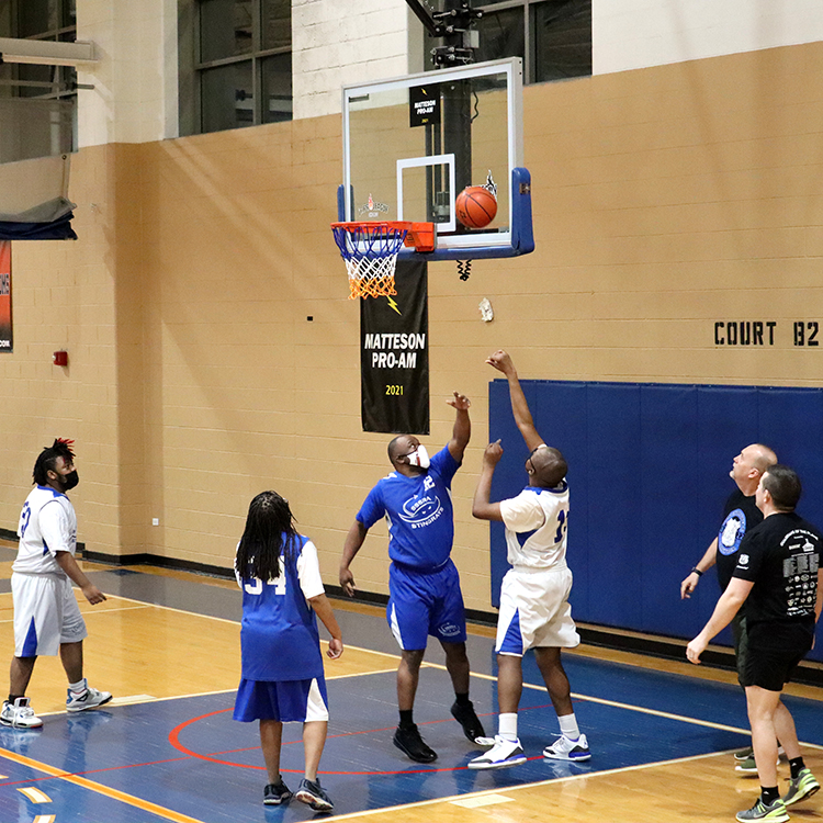 Stingrays basketball player shoots a basket.