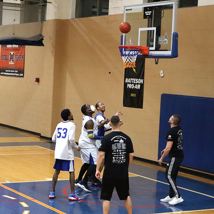 Stingrays basketball player shoots a basket.
