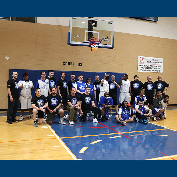 Group shot of Stingrays athletes and players from police departments.
