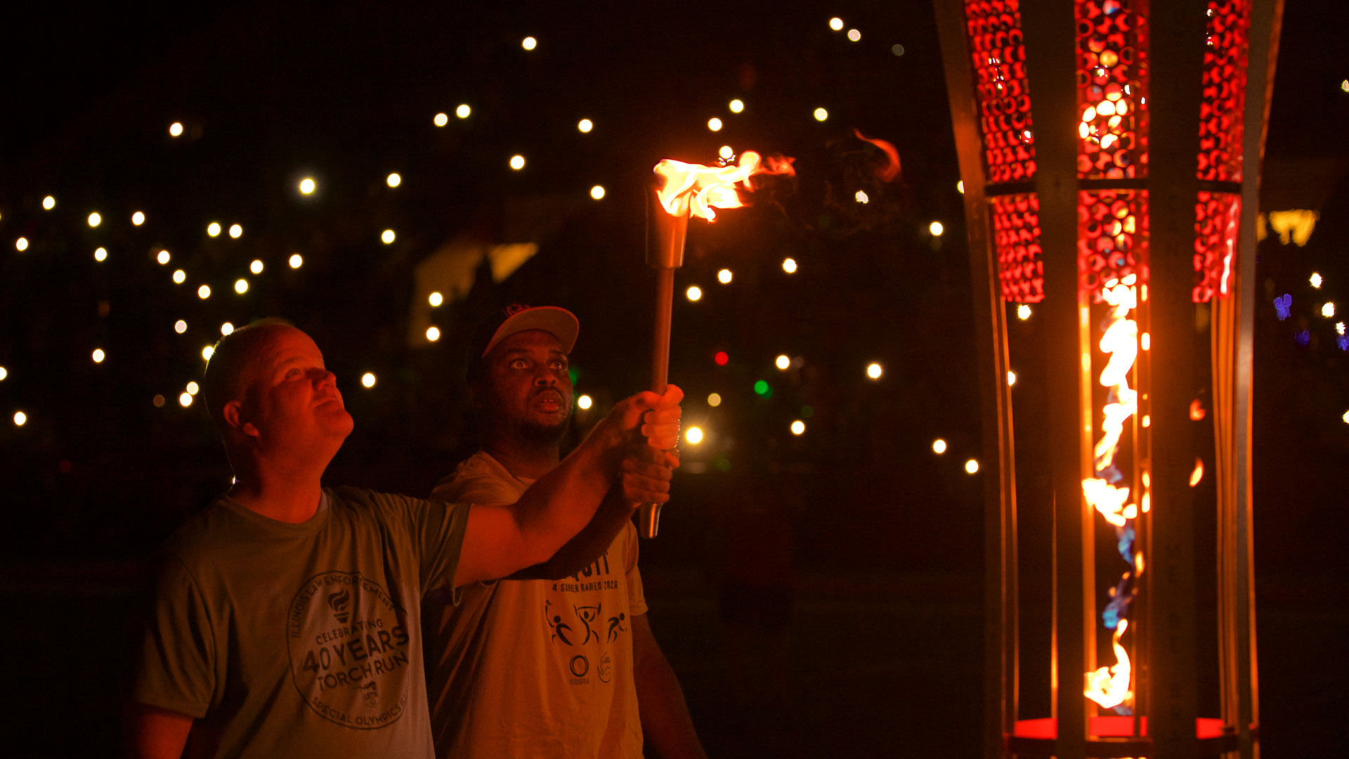 SSSRA athlete assits in lighting the torch.