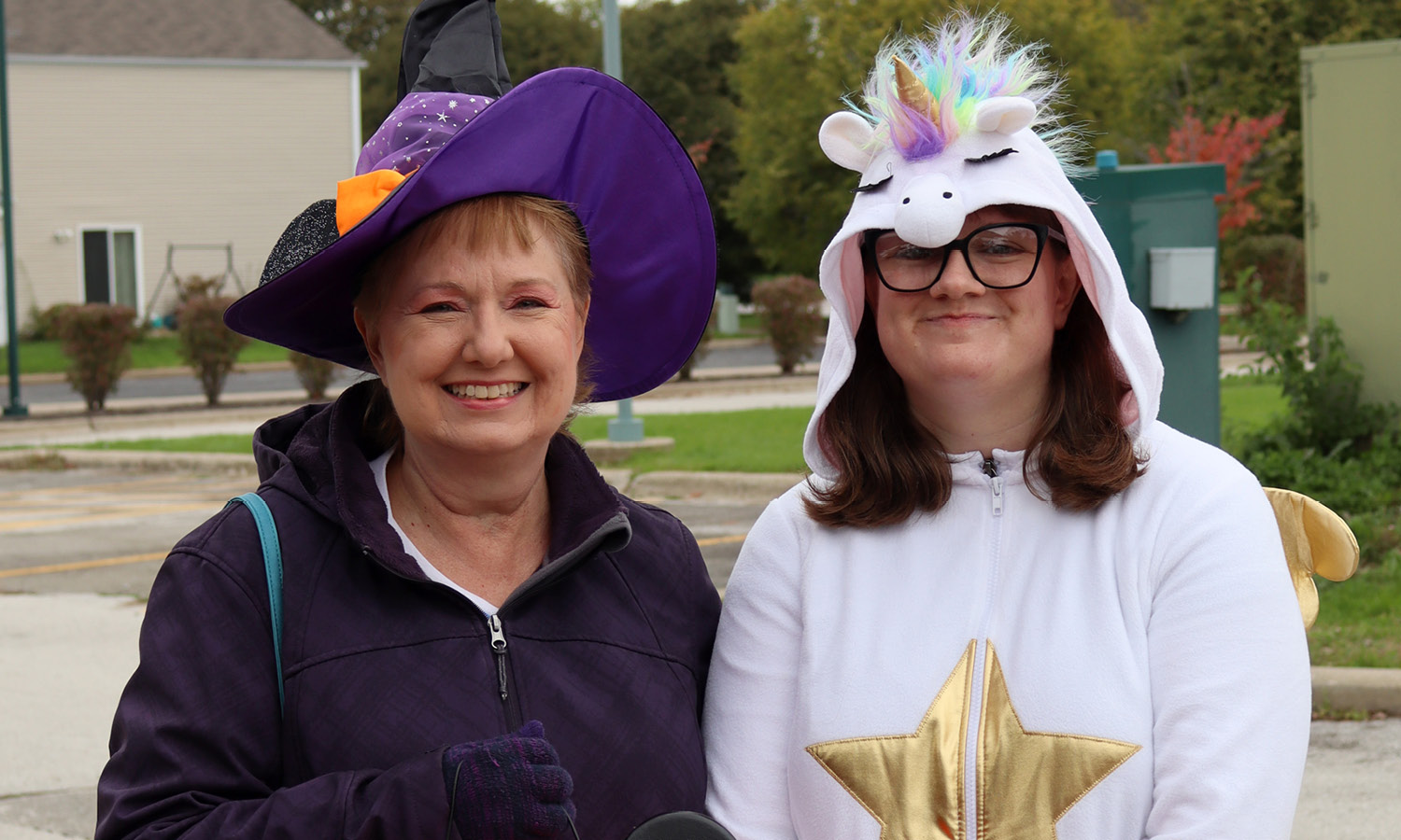 Two smiling women dressed up for Halloween. 