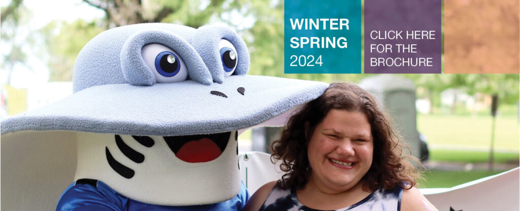 SSSRA participant smiling and posing with SSSRA mascot, Sammy Stingray. Text: Winter Spring 2024, Click here for the brochure